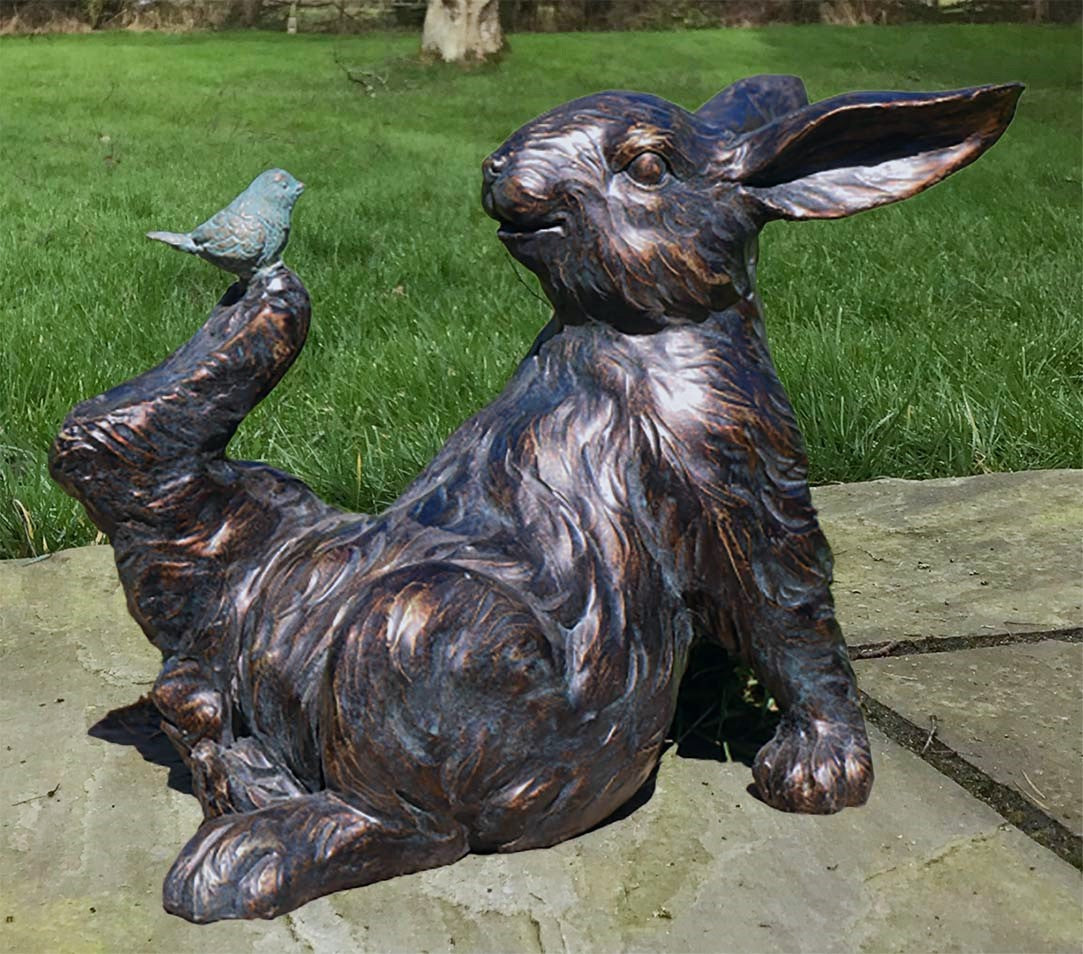 Playful Rabbit with a Bird on Foot figurine, novelty home or garden decoration (21cm)