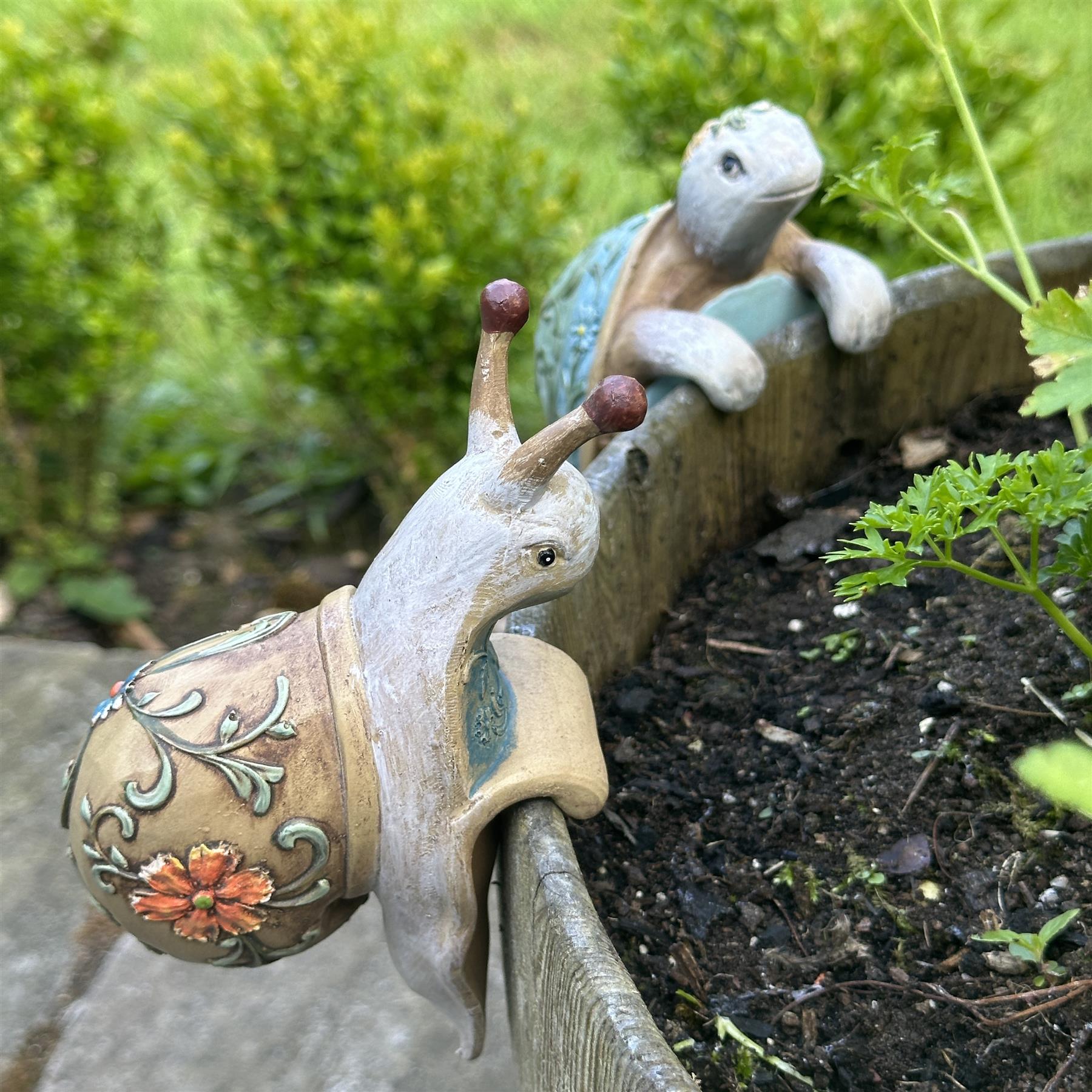 BOX OF FOUR Flower pot hangers, wood effect bohemian colours (2 each of Tortoise & Snail)