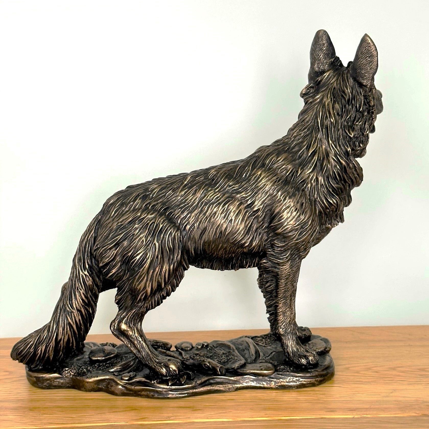 Heavy weight dark bronze effect German Shepherd Dog figurine, 26cm long