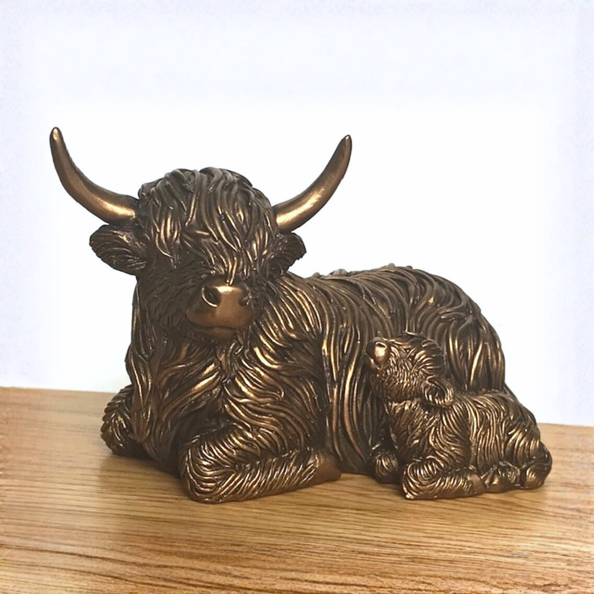 Laying Highland Cow Mother & Calf ornament figurine from the Leonardo Reflections Bronzed range